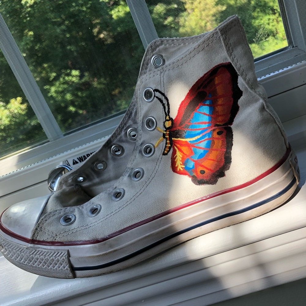 Slightly worn butterfly painted converse